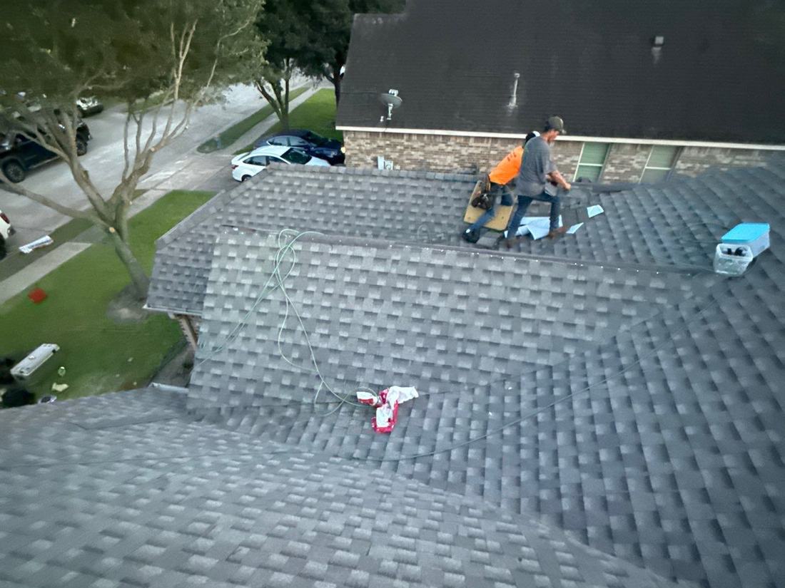 Houston Roofing crew installing architectural shingles on a Pearland home